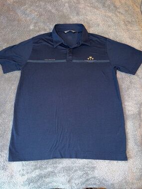 TravisMathew Navy Polo with Subtle Chest Stripe and Palm Logo